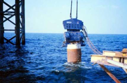 Steam hammers weren't the only type of pile driving equiment Vulcan sent offshore; this Vulcan 4600 vibratory hammer is shown driving piles into the Gulf in the early 1990's. Vibratory hammers were an excellent choice in certain applications, and they were naturally adept at underwater driving.
