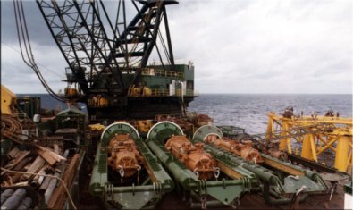 The deck of an offshore derrick barge was a busy place. This was taken on a McDermott barge, showing the hammers along with a good deal of other equipment, ready to start installing piles.